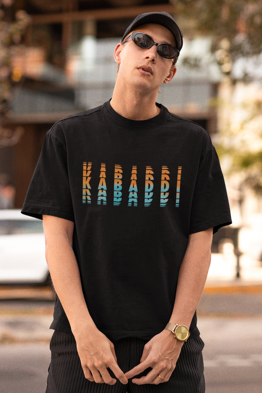 A model wearing black oversized tshirt with the text "kabaddi"' , indian streetwear, desi designs, indian sports