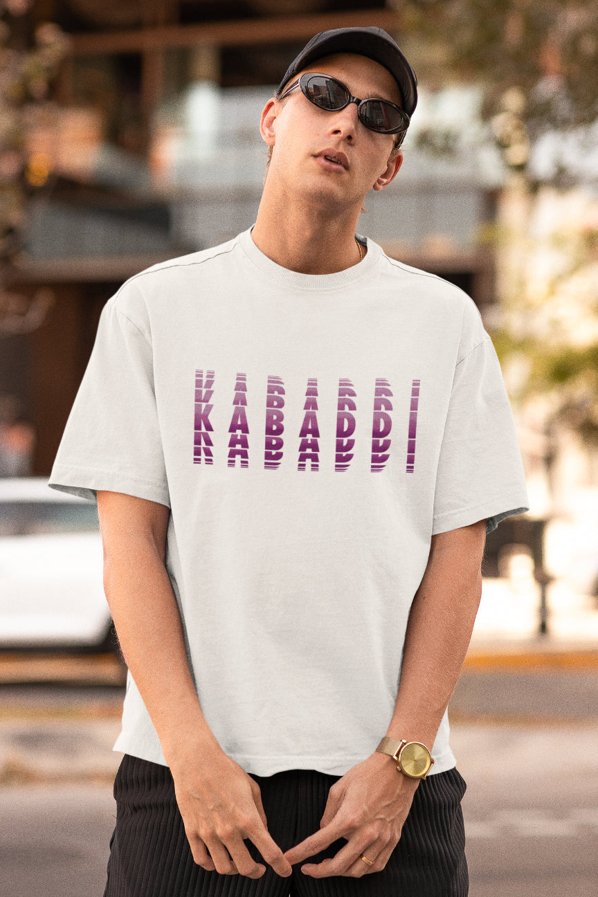 A model wearing white oversized tshirt with the text "kabaddi"' , indian streetwear, desi designs