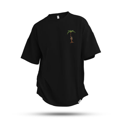 A black oversized tshirt with the illustration of man climbing a coconut tree indian streetwear, desi designs,